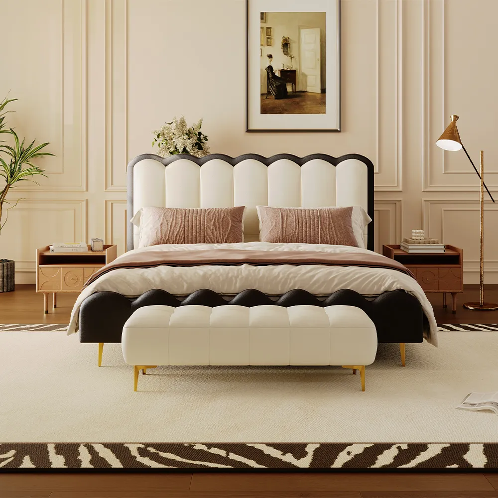 Scalloped black and white headboard bed with matching bench, beige bedding, and modern nightstands in a luxury bedroom