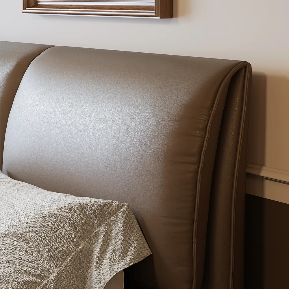 Queen-size coffee faux leather bed with metal legs, gray bedding, and wooden nightstands in a modern bedroom.