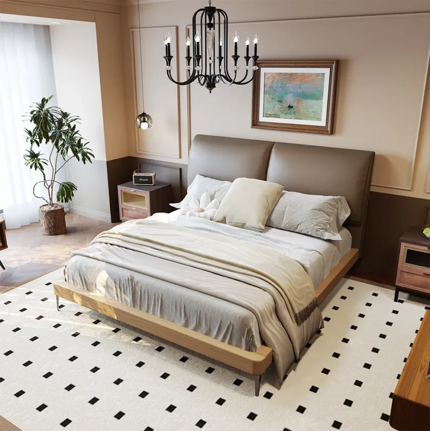 Queen-size coffee faux leather bed with metal legs, gray bedding, and wooden nightstands in a modern bedroom.