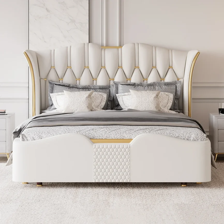 Queen-size tufted wingback bed with gold accents and gray bedding in an elegant, marble-accented bedroom