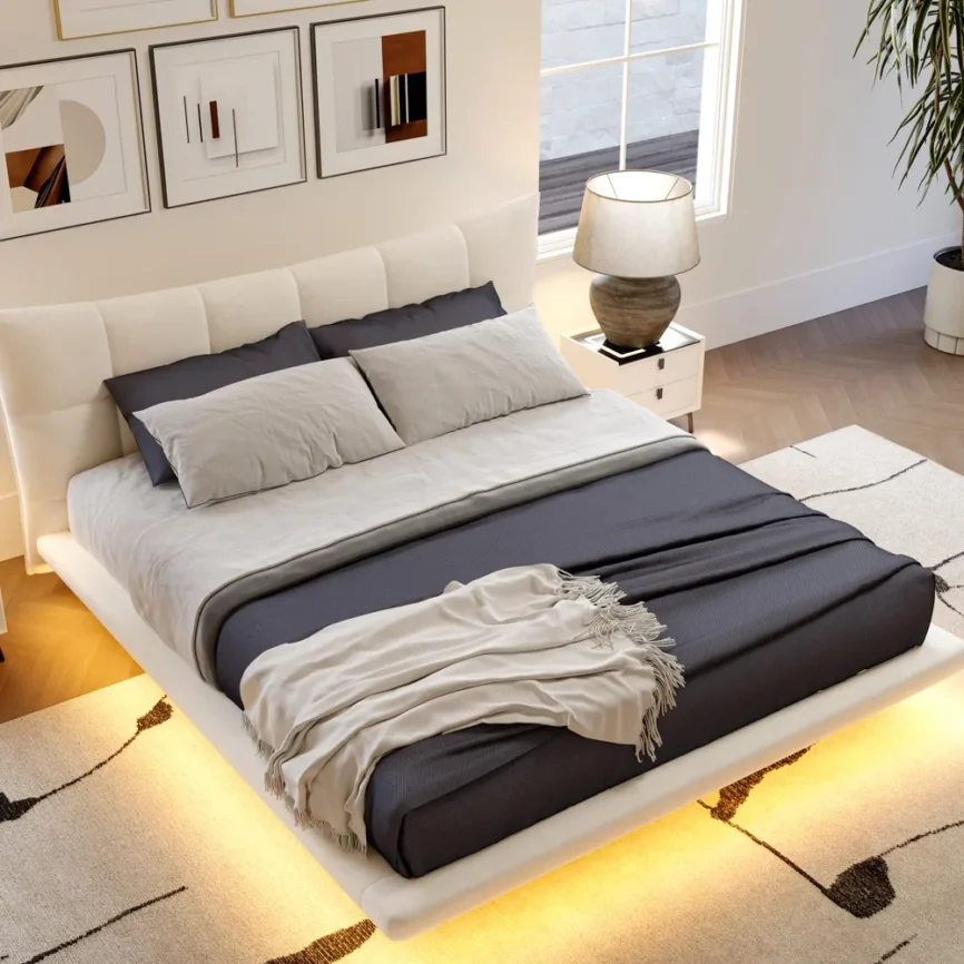 Beige velvet upholstered bed with smart lighting, dark bedding, and matching nightstands in a modern bedroom.