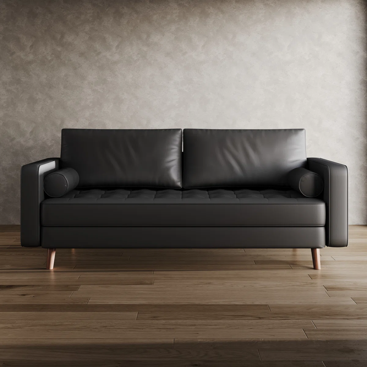 Modern black faux leather sofa with tufted seat, bolster pillows, and wooden legs in a bright room.