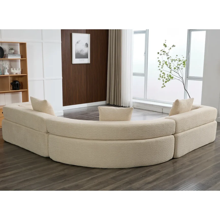 Modern curved modular bouclé sectional sofa in blue fabric featuring a contemporary design, high-density foam cushions, square arms, and decorative throw pillows