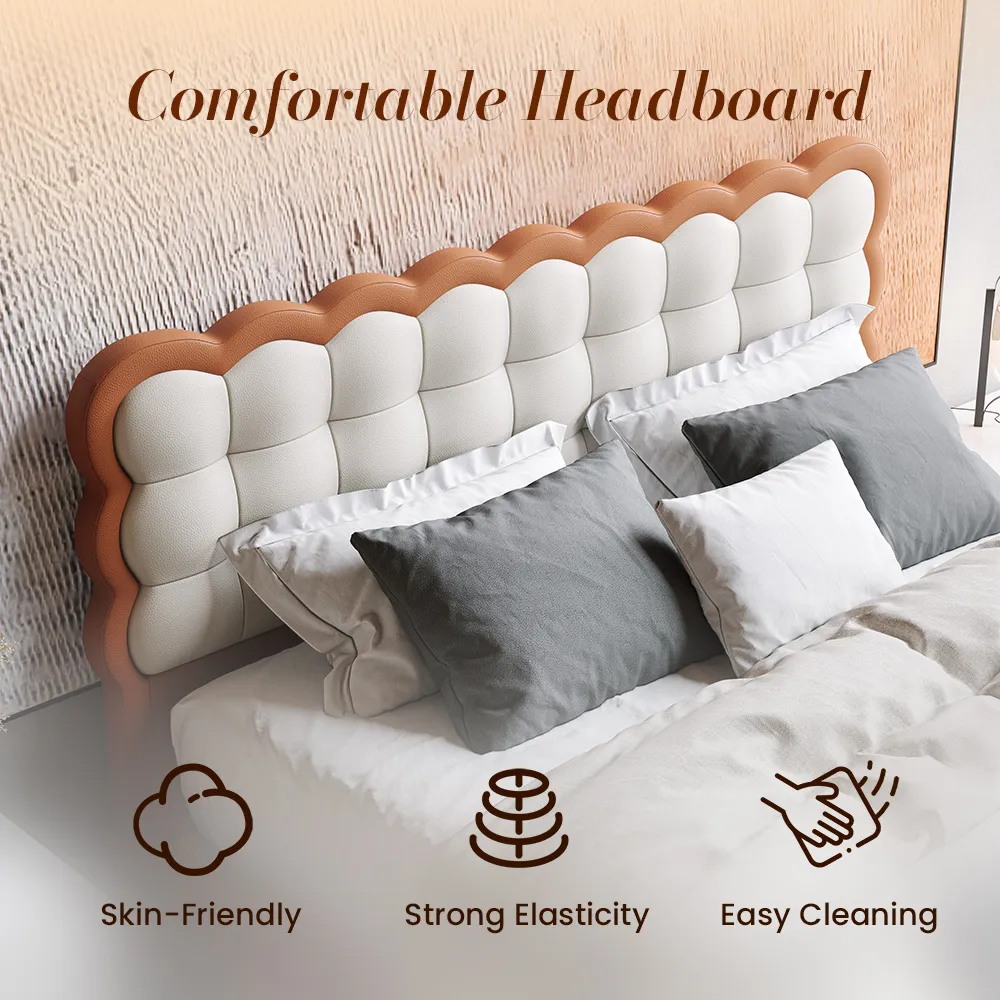 A contemporary bedroom featuring the Cove Leather Bed in white and orange, with a scalloped headboard and footboard design.