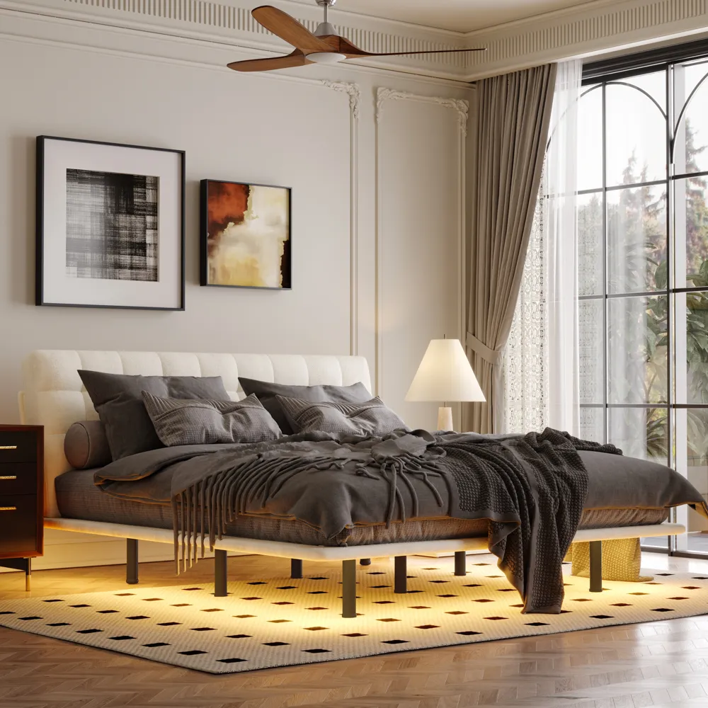 A modern bedroom featuring a neatly made bed with a padded headboard and white comforter.