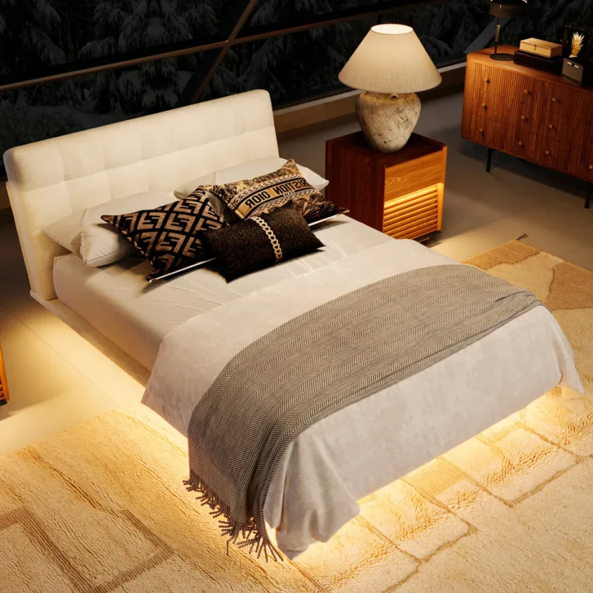 A modern bedroom featuring a neatly made bed with a padded headboard and white comforter.