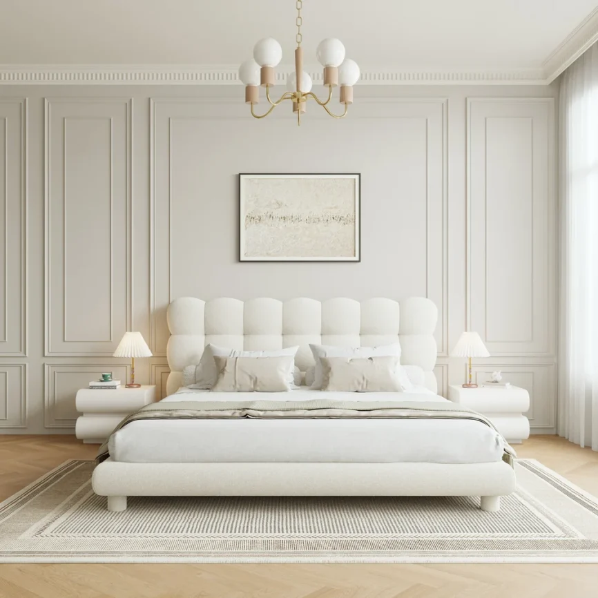 A luxurious bedroom featuring a cream upholstered platform bed with a tufted headboard