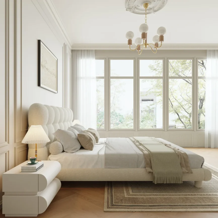A luxurious bedroom featuring a cream upholstered platform bed with a tufted headboard