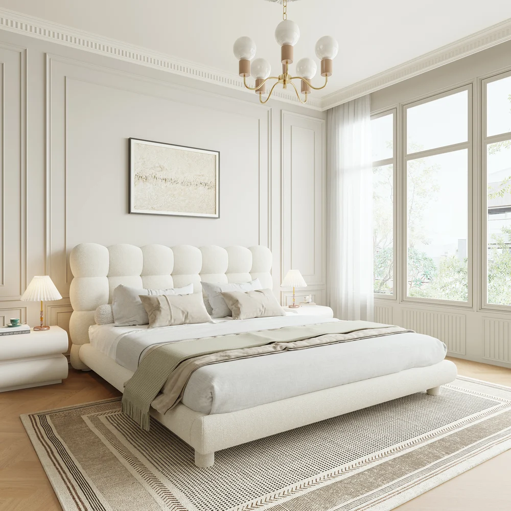 A luxurious bedroom featuring a cream upholstered platform bed with a tufted headboard
