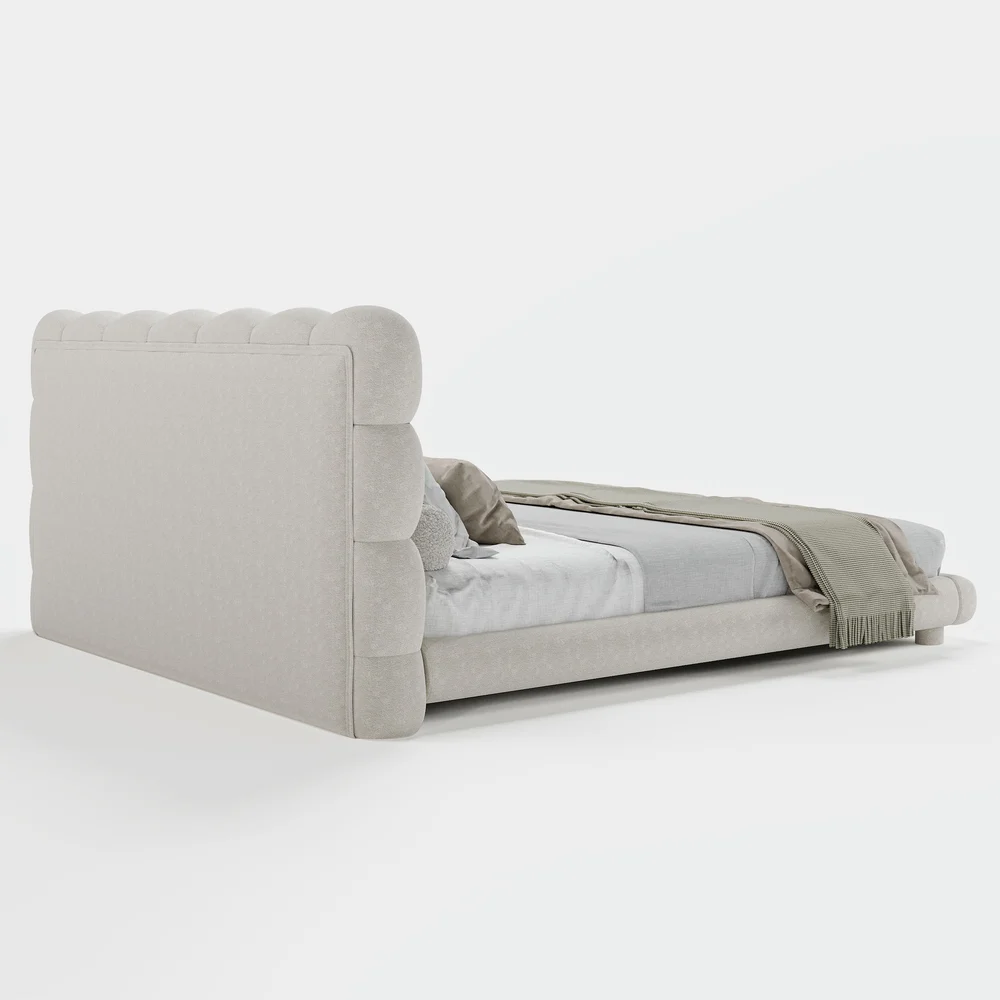 A luxurious bedroom featuring a cream upholstered platform bed with a tufted headboard