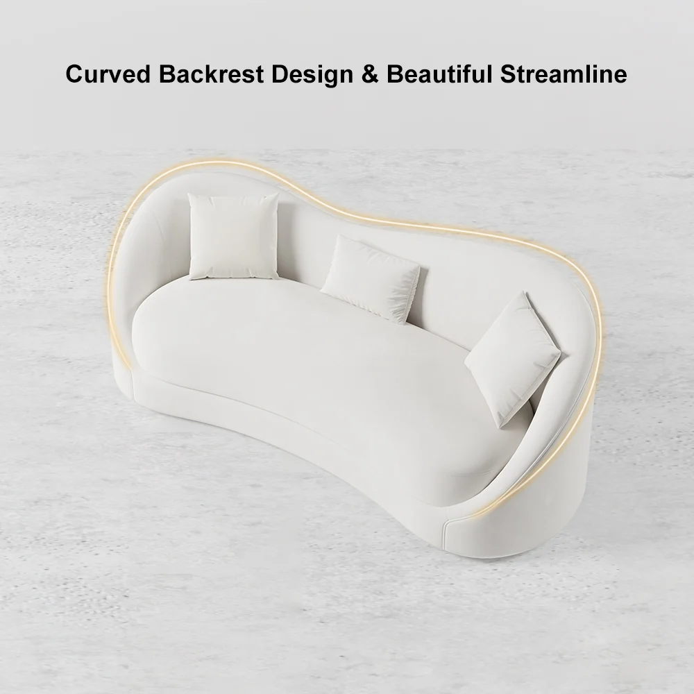 White curved 3-seater sofa with throw pillows and gold coffee table in a modern minimalist living room