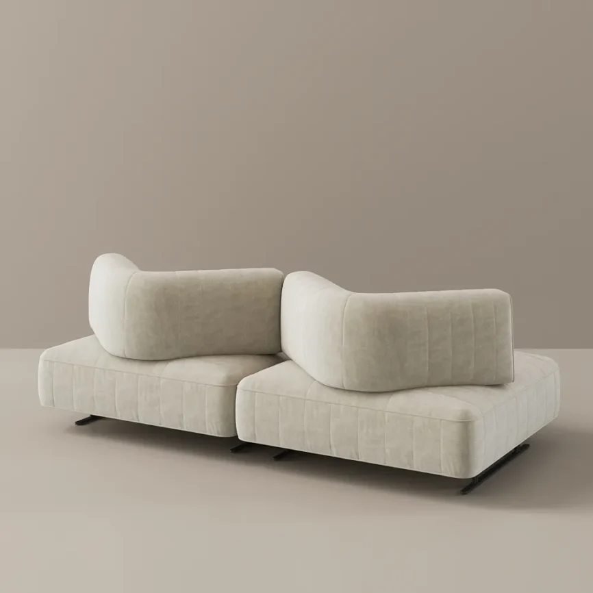 Light beige modular sectional sofa with tufted cushions, stitched backrests, and black metal legs