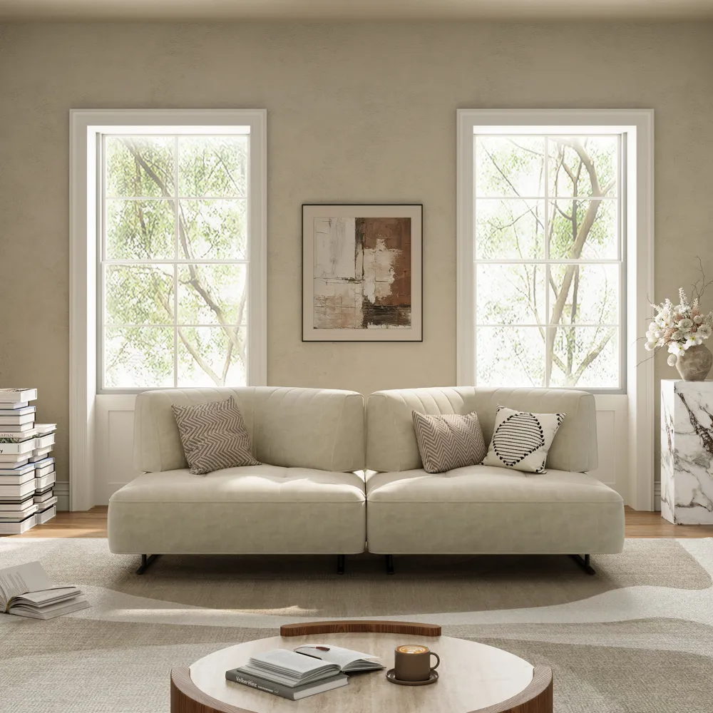 Light beige modular sectional sofa with tufted cushions, stitched backrests, and black metal legs
