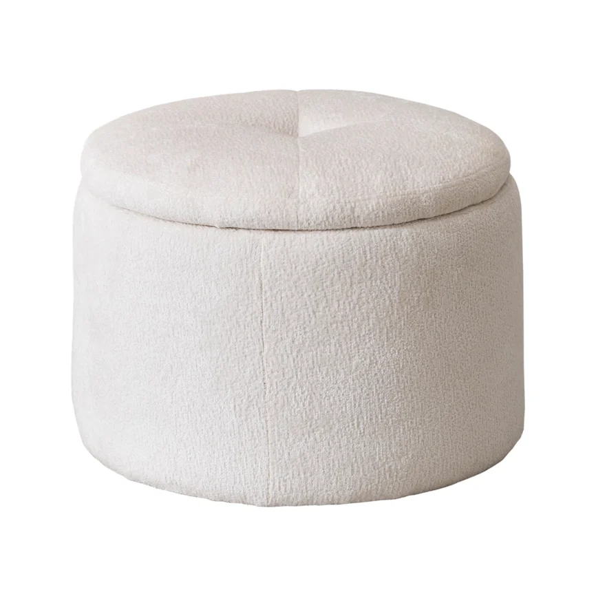 round upholstered ottoman in light beige chenille fabric with tufted top on neutral carpet