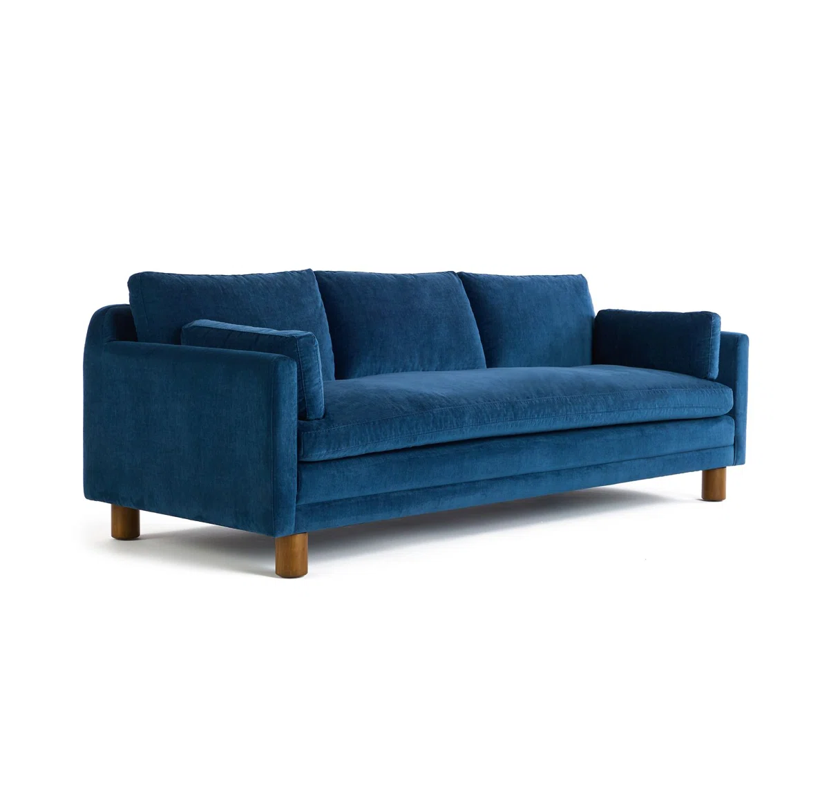Modern dark blue sofa with three cushions, square arms, and wooden legs, highlighting modular section