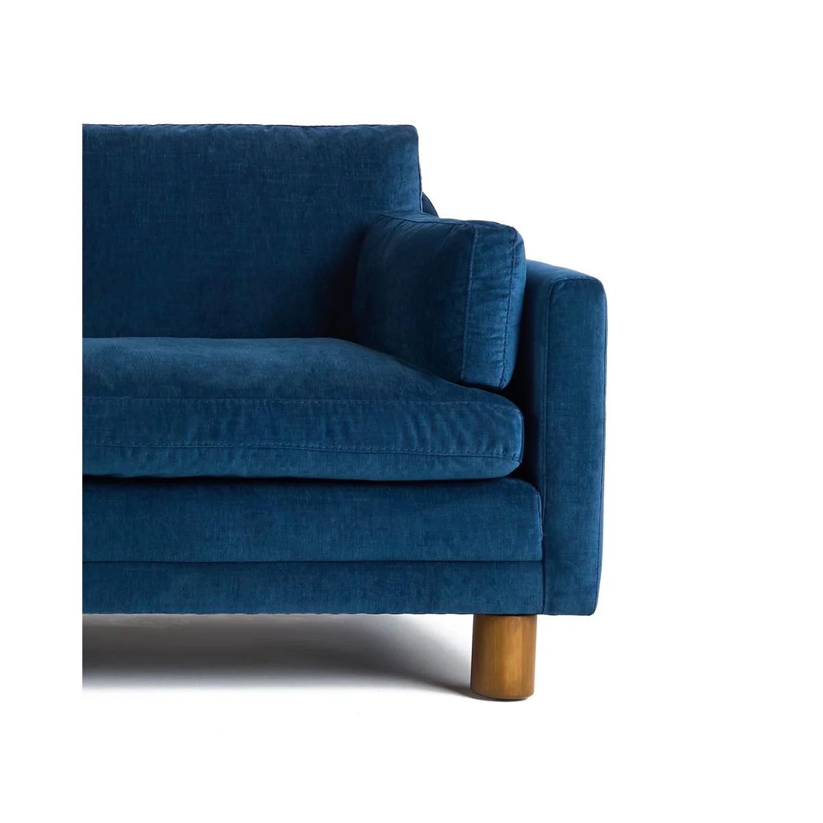 Modern dark blue sofa with three cushions, square arms, and wooden legs, highlighting modular section