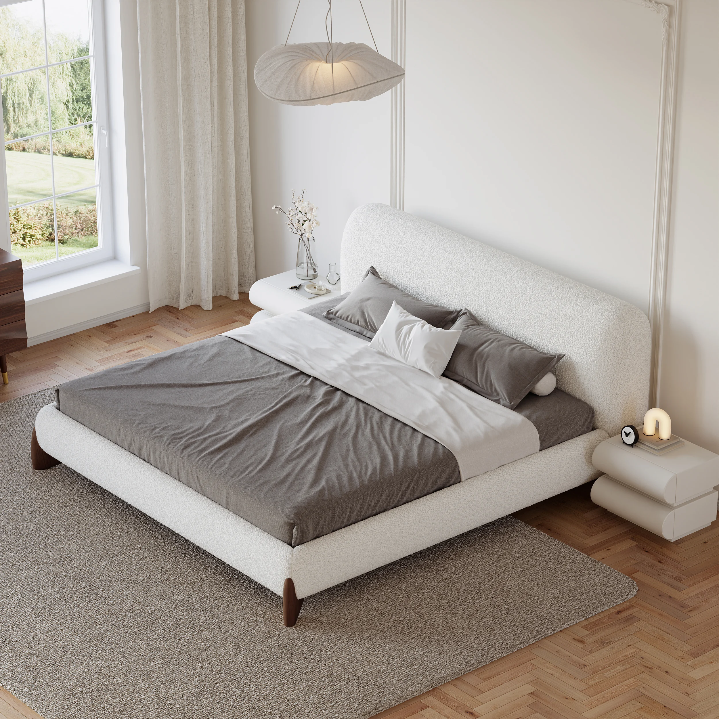 A serene bedroom featuring a white upholstered platform bed with a tufted headboard
