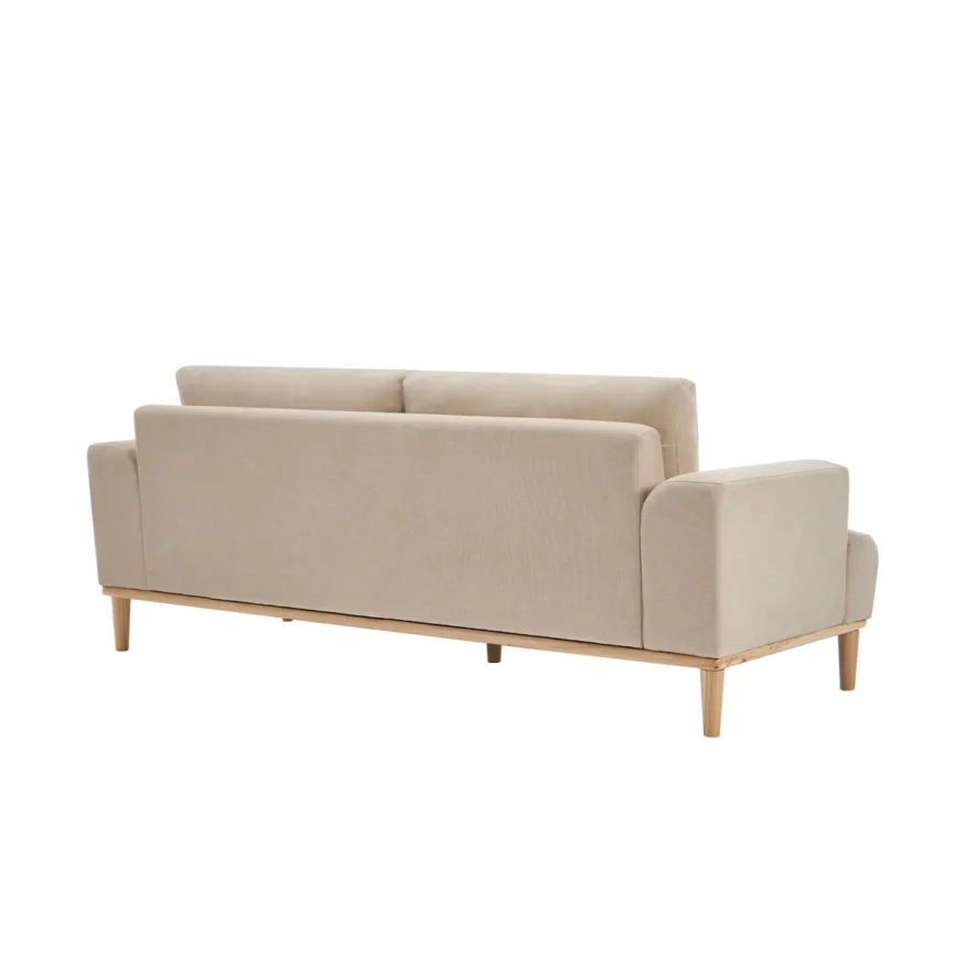 Beige sofa with wooden base and legs in a minimalist living room with neutral tones