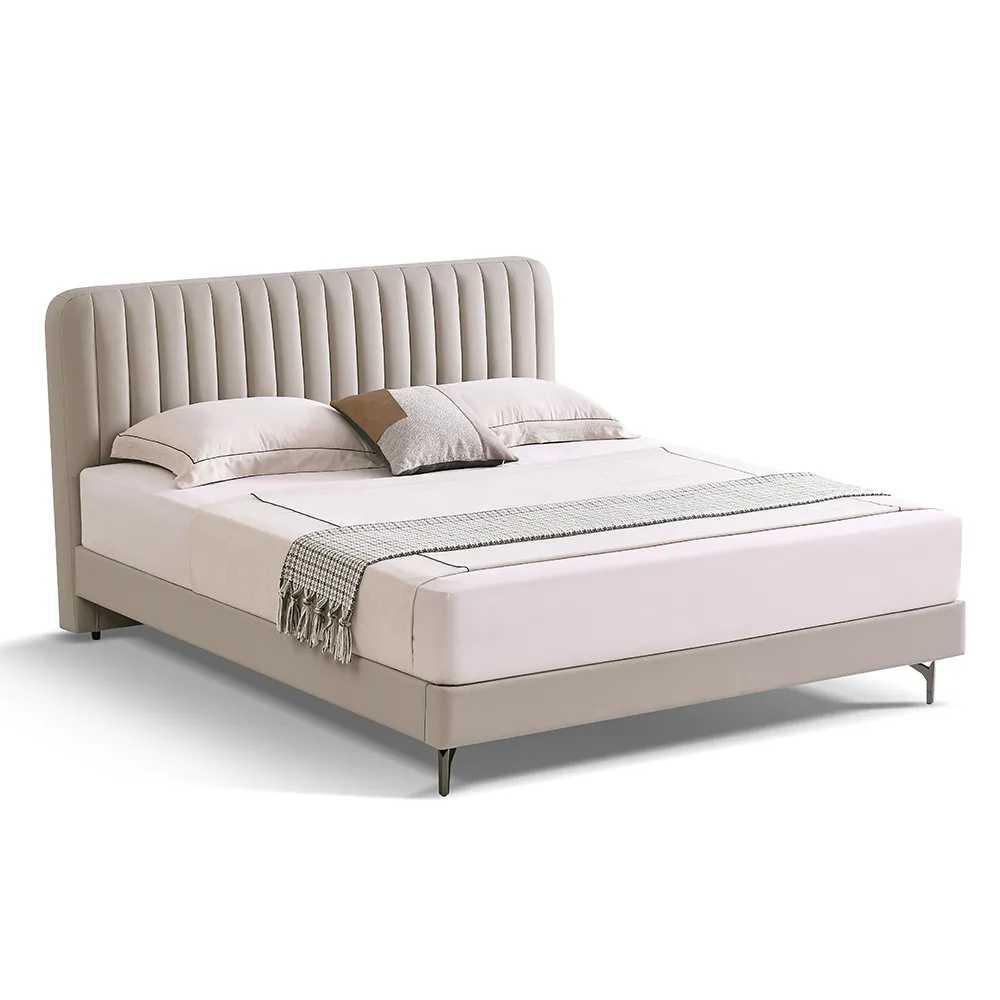 A contemporary bedroom featuring a light beige upholstered bed
