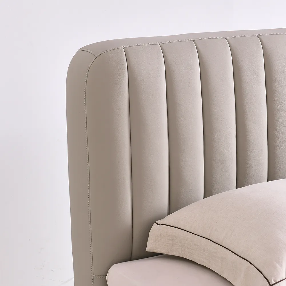 A contemporary bedroom featuring a light beige upholstered bed
