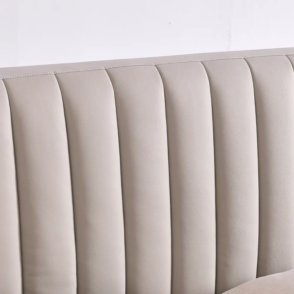 A contemporary bedroom featuring a light beige upholstered bed
