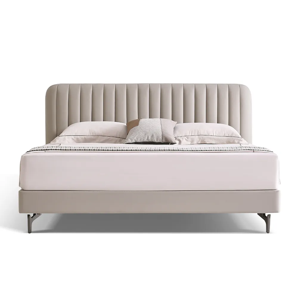 Light beige upholstered bed with vertical channeled headboard and metal legs in a modern minimalist bedroom