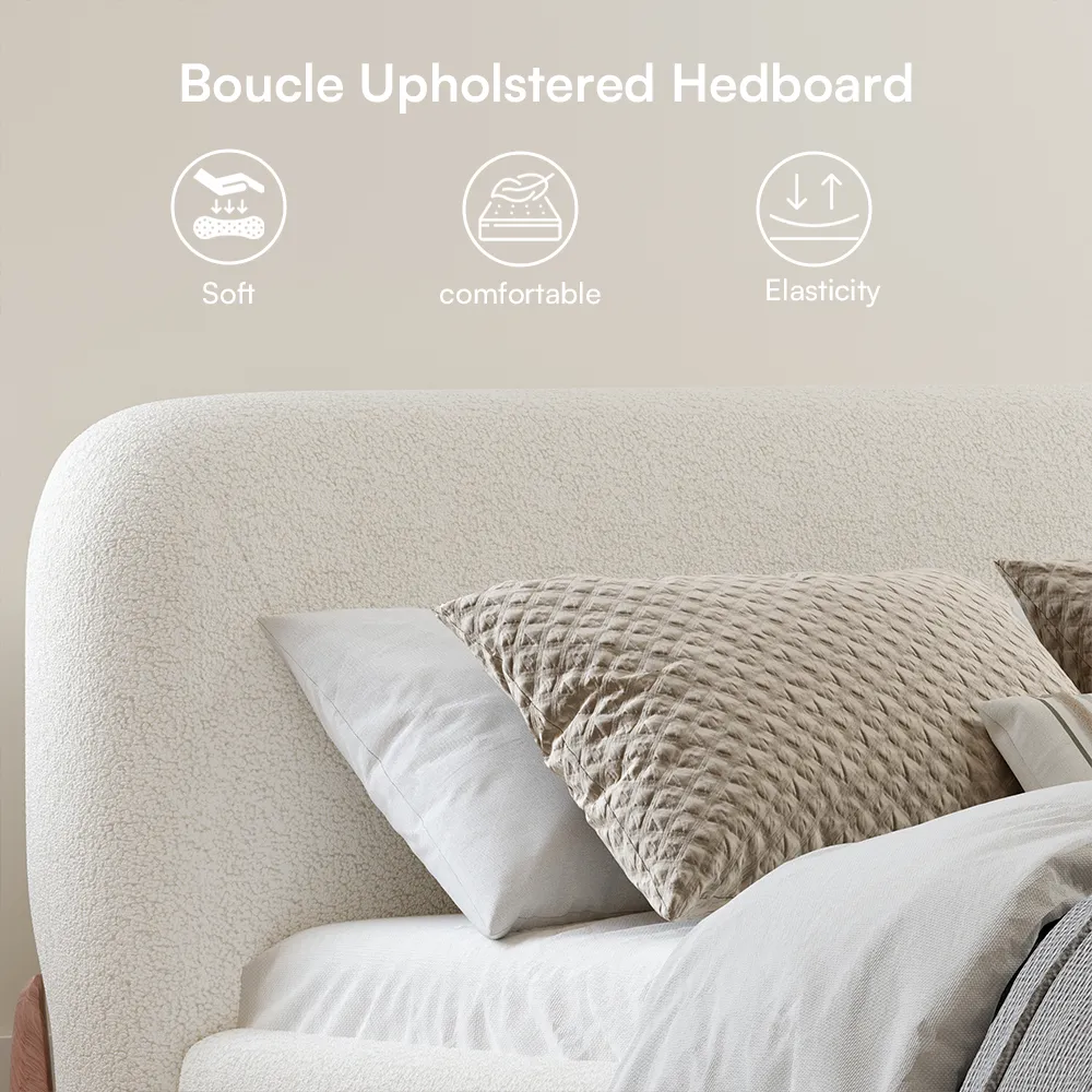 A minimalist upholstered bed in textured white boucle fabric with rounded edges and outward-curving wooden legs.