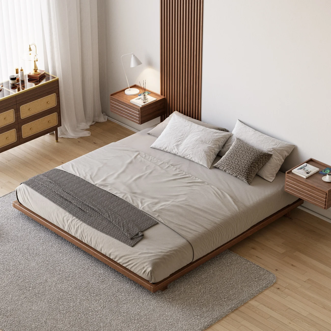 A minimalist bedroom featuring a low-profile wooden bed with a matching headboard and neutral bedding in beige and gray tones