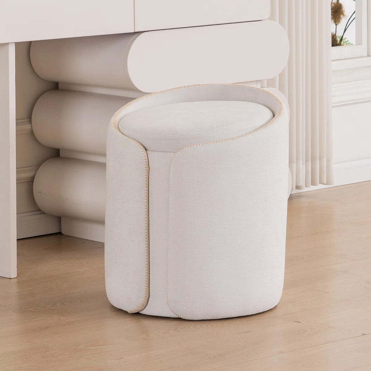 Velvet Storage Pouf – Beige elegance with sculptural curves and hidden storage for modern interiors.