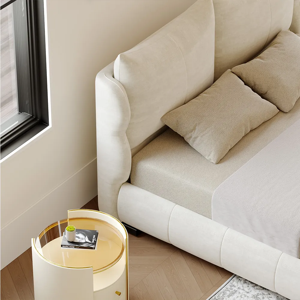 A modern upholstered queen bed in soft beige fabric with a rounded, cushioned frame and short black legs