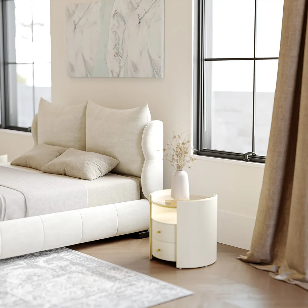 A modern upholstered queen bed in soft beige fabric with a rounded, cushioned frame and short black legs