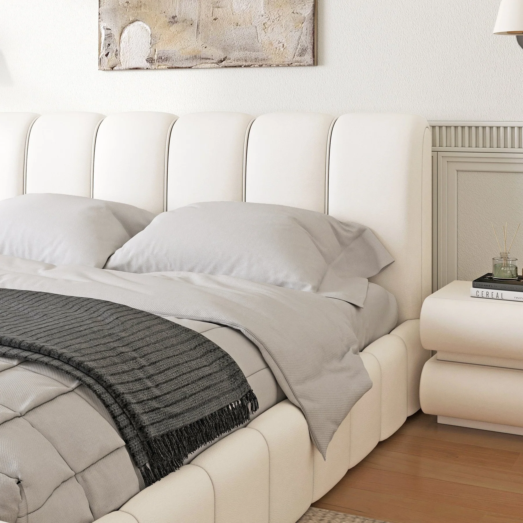 A modern bedroom featuring a white upholstered bed with a tall, vertically paneled headboard and matching footboard.