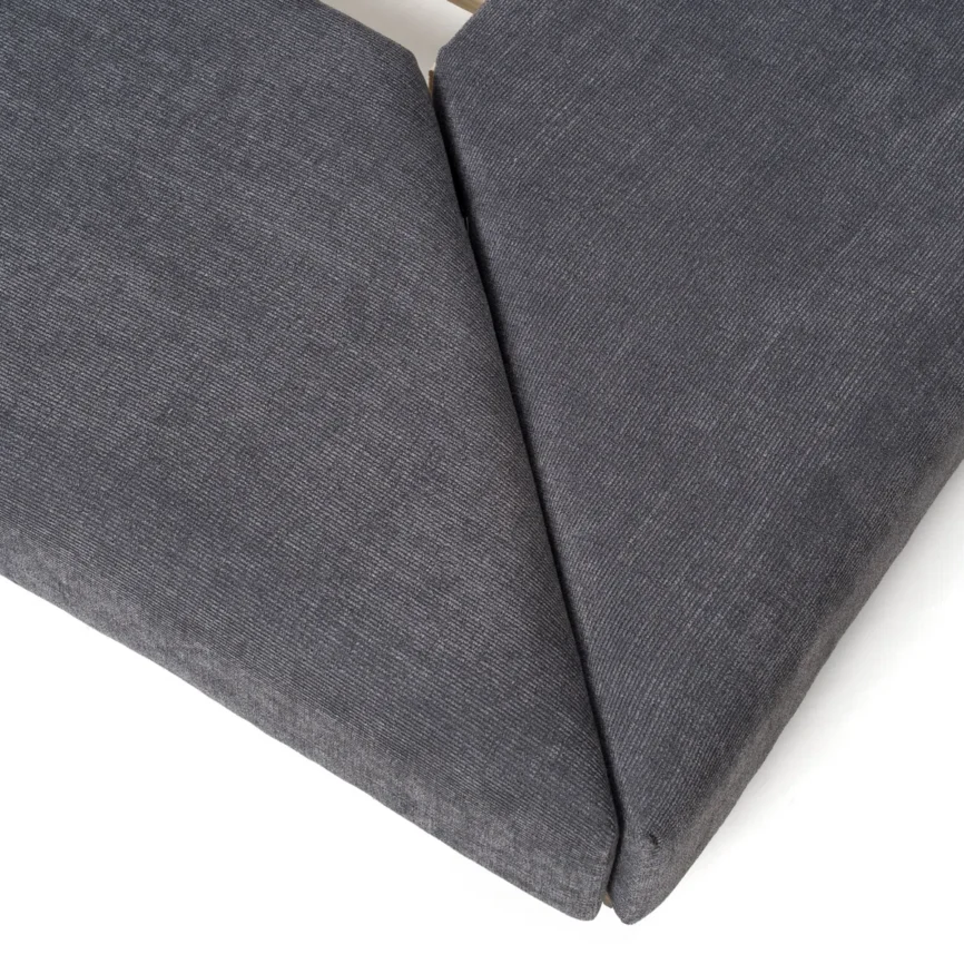 Grey upholstered platform bed with oak nightstands, channeled headboard, and minimalist bedding in a modern bedroom.