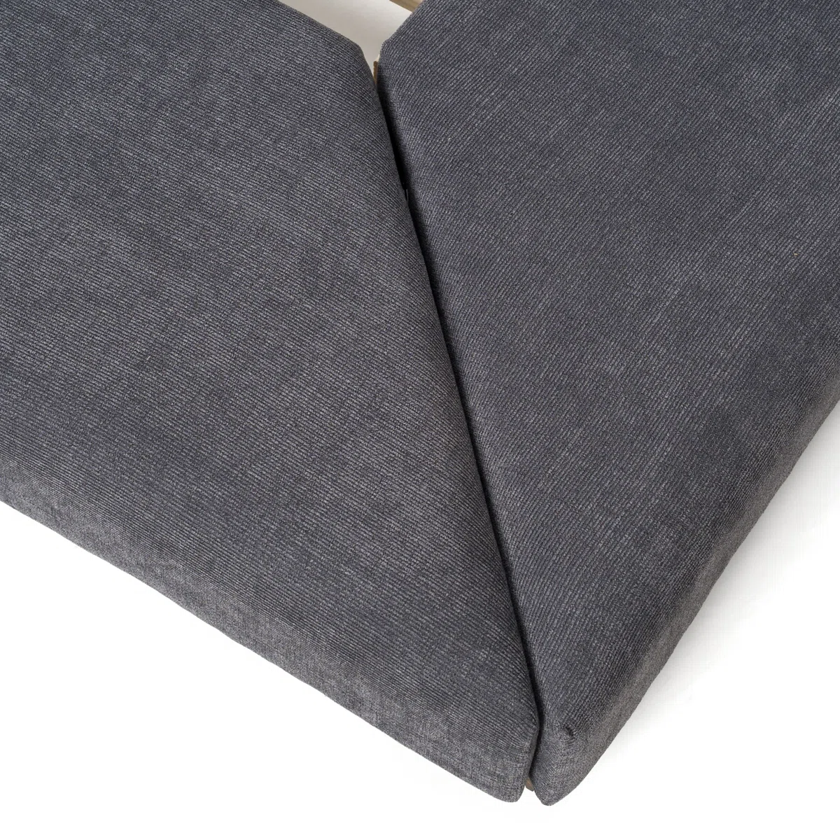 Grey upholstered platform bed with oak nightstands, channeled headboard, and minimalist bedding in a modern bedroom.