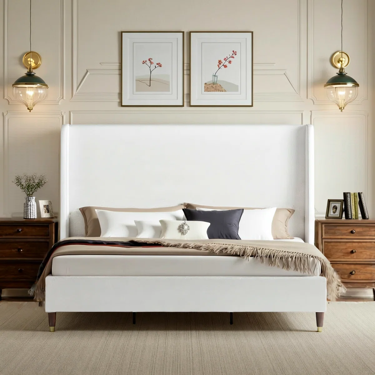 White upholstered bed with ribbed headboard, layered pillows, beige throw, and wooden nightstands in a neutral bedroom.