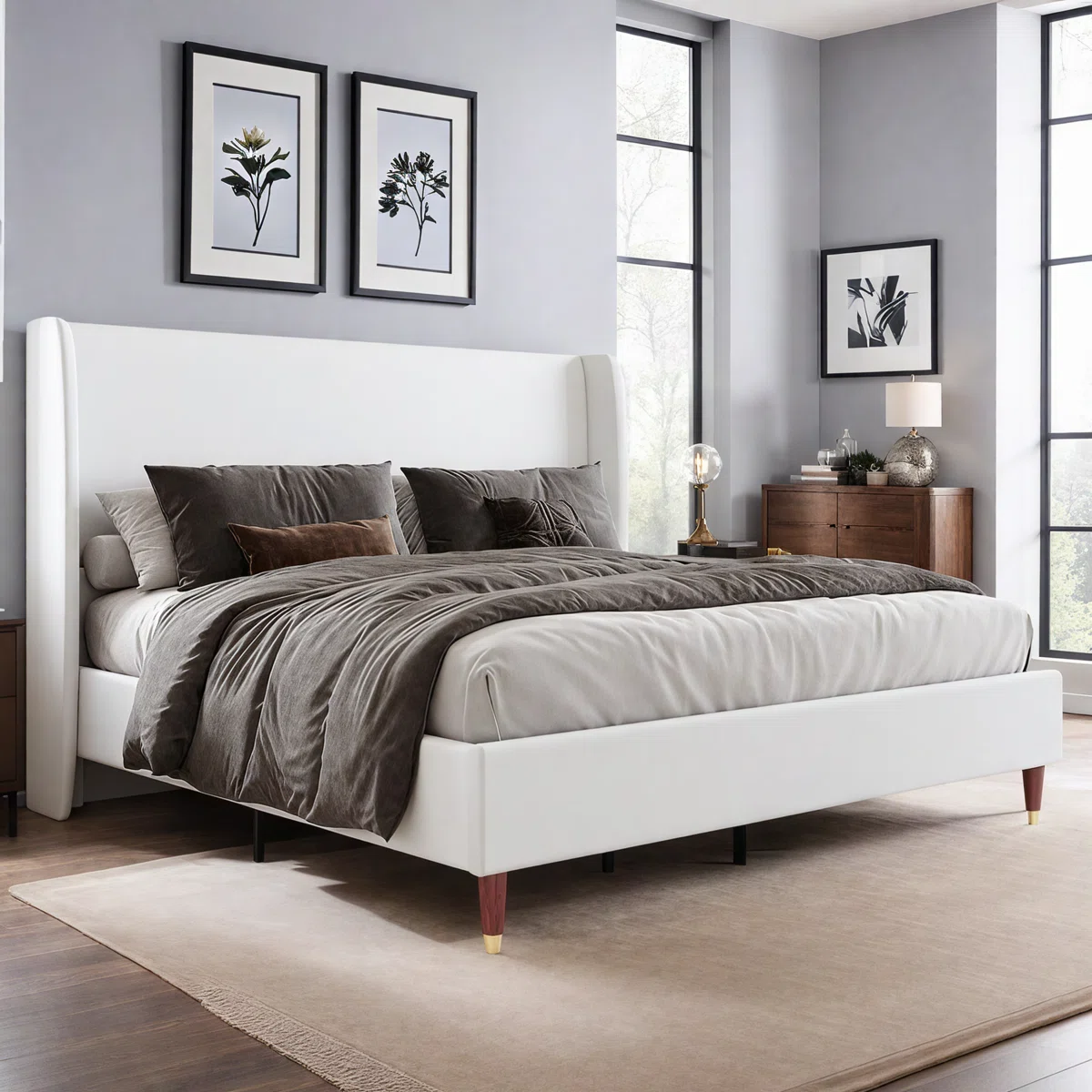 White upholstered bed with ribbed headboard, layered pillows, beige throw, and wooden nightstands in a neutral bedroom.