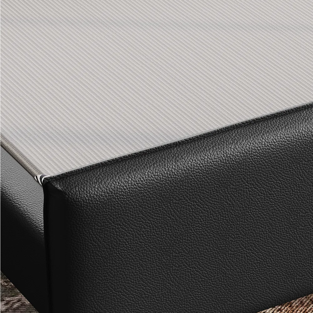 A king-size upholstered bed in black faux leather featuring a wingback headboard and matching footboard