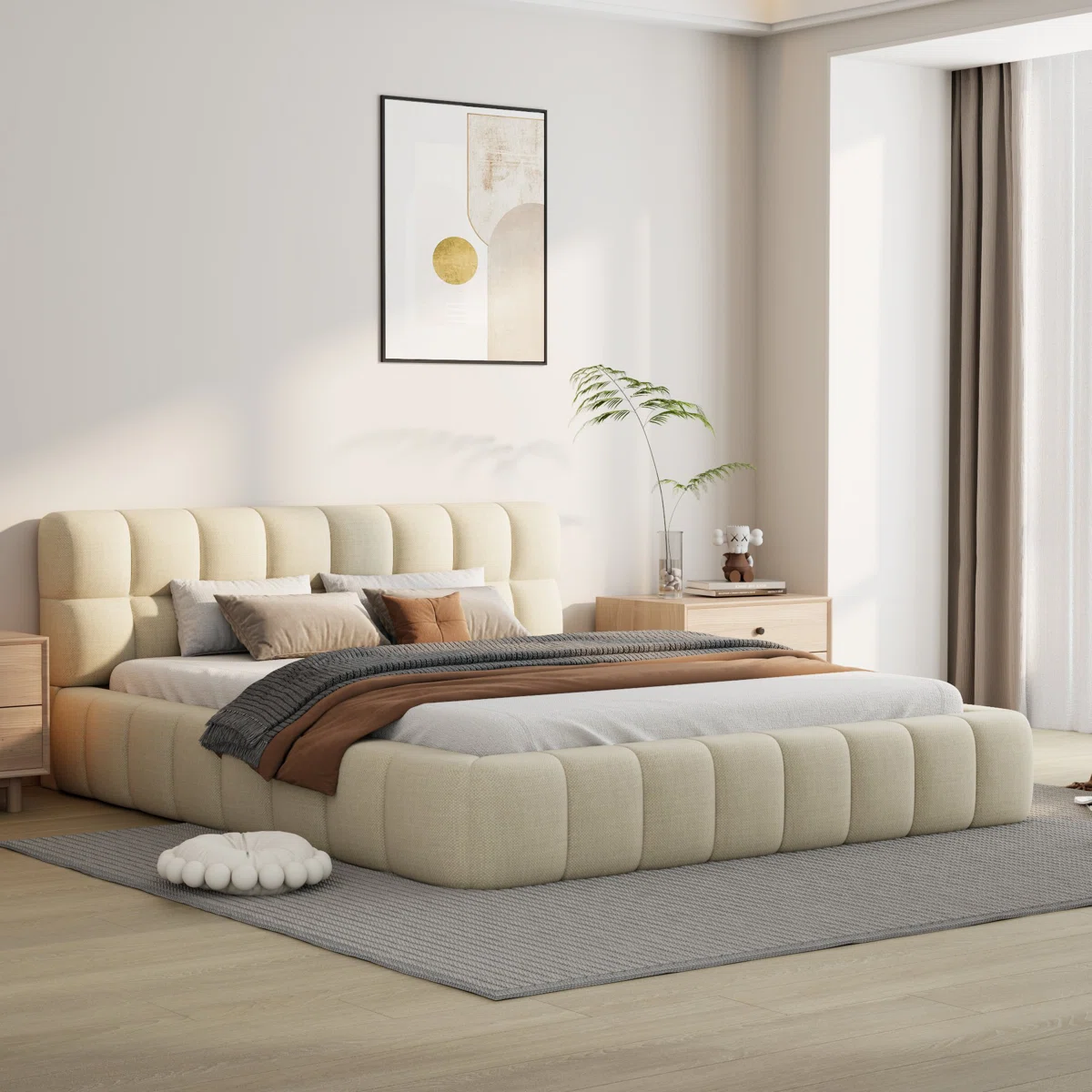 Beige upholstered bed with grid-patterned headboard, layered bedding, and light wood nightstands in a modern bedroom.