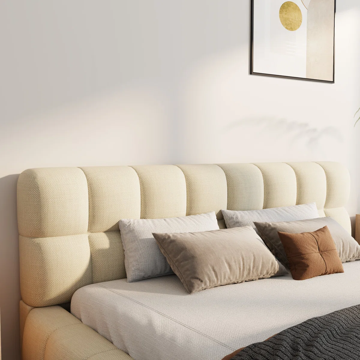 Beige upholstered bed with grid-patterned headboard, layered bedding, and light wood nightstands in a modern bedroom.