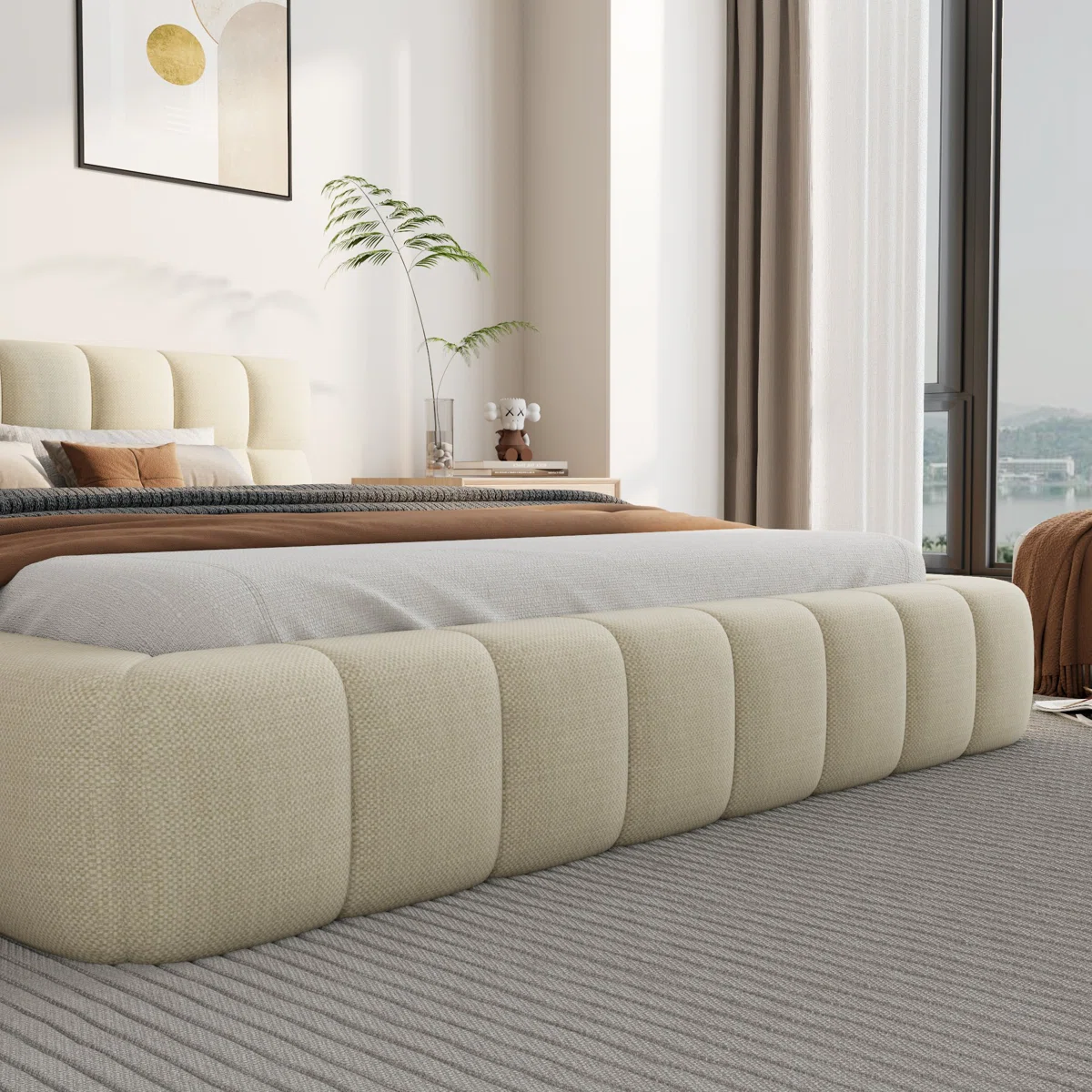 Beige upholstered bed with grid-patterned headboard, layered bedding, and light wood nightstands in a modern bedroom.
