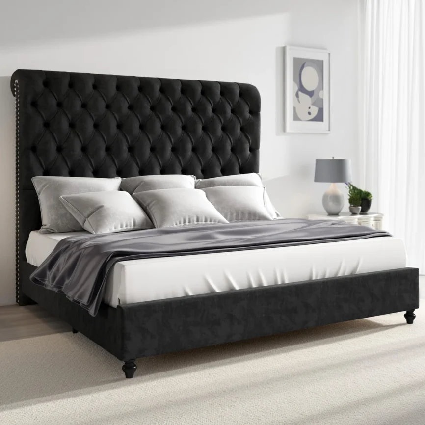 Black velvet sleigh bed with tufted headboard, white-gray bedding, and modern nightstands in a light-filled bedroom.