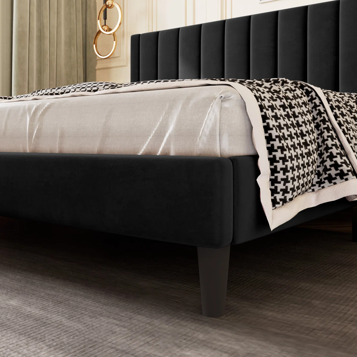 Black velvet bed with vertical tufted headboard, white bedding, and checkered blanket in a modern bedroom.