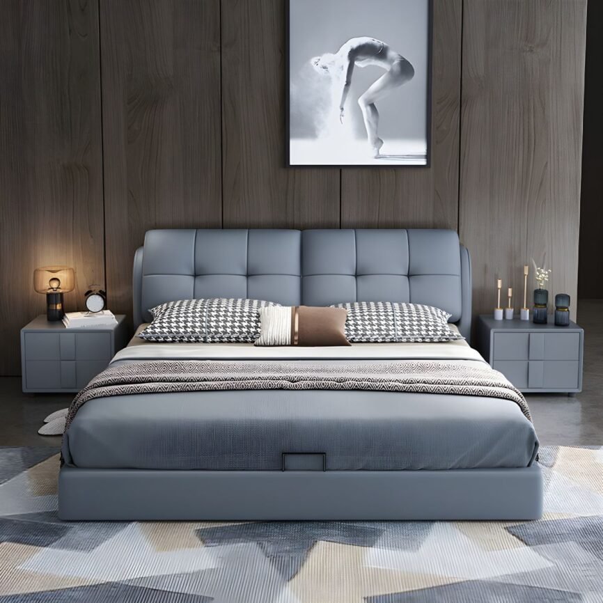 Grey tufted bed with patterned pillows, wood-paneled wall, and symmetrical nightstands in a modern bedroom.