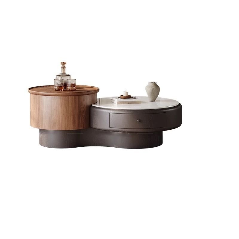 modern round coffee table with microlite top and black pedestal base