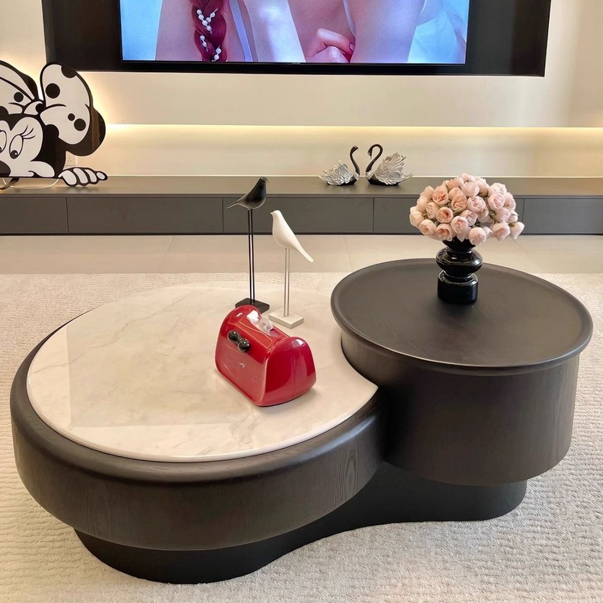 modern round coffee table with microlite top and black pedestal base