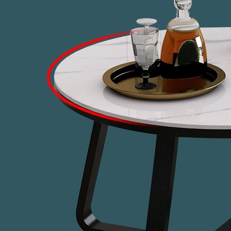 aris round glass coffee table with cross‑leg base