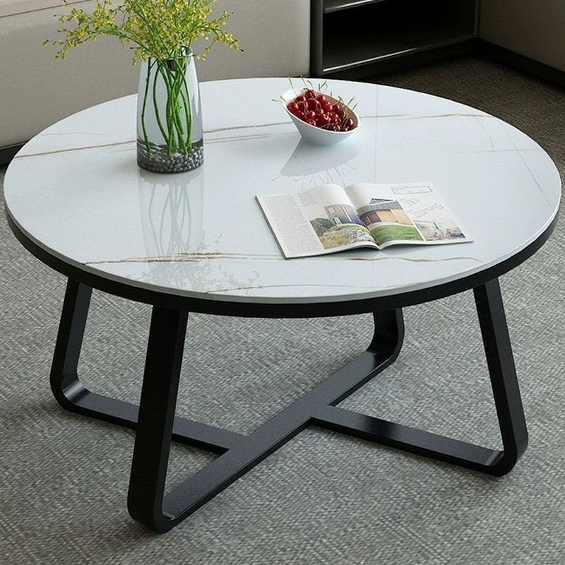 aris round glass coffee table with cross‑leg base