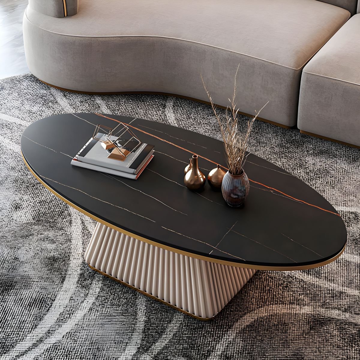 Aurora Glam Oval Pedestal Cocktail Table with stone top and faux leather base, available in black, white, and beige finishes