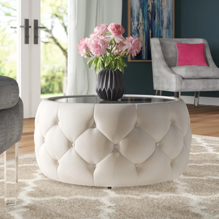 eraman round glass top coffee table with velvet drum base