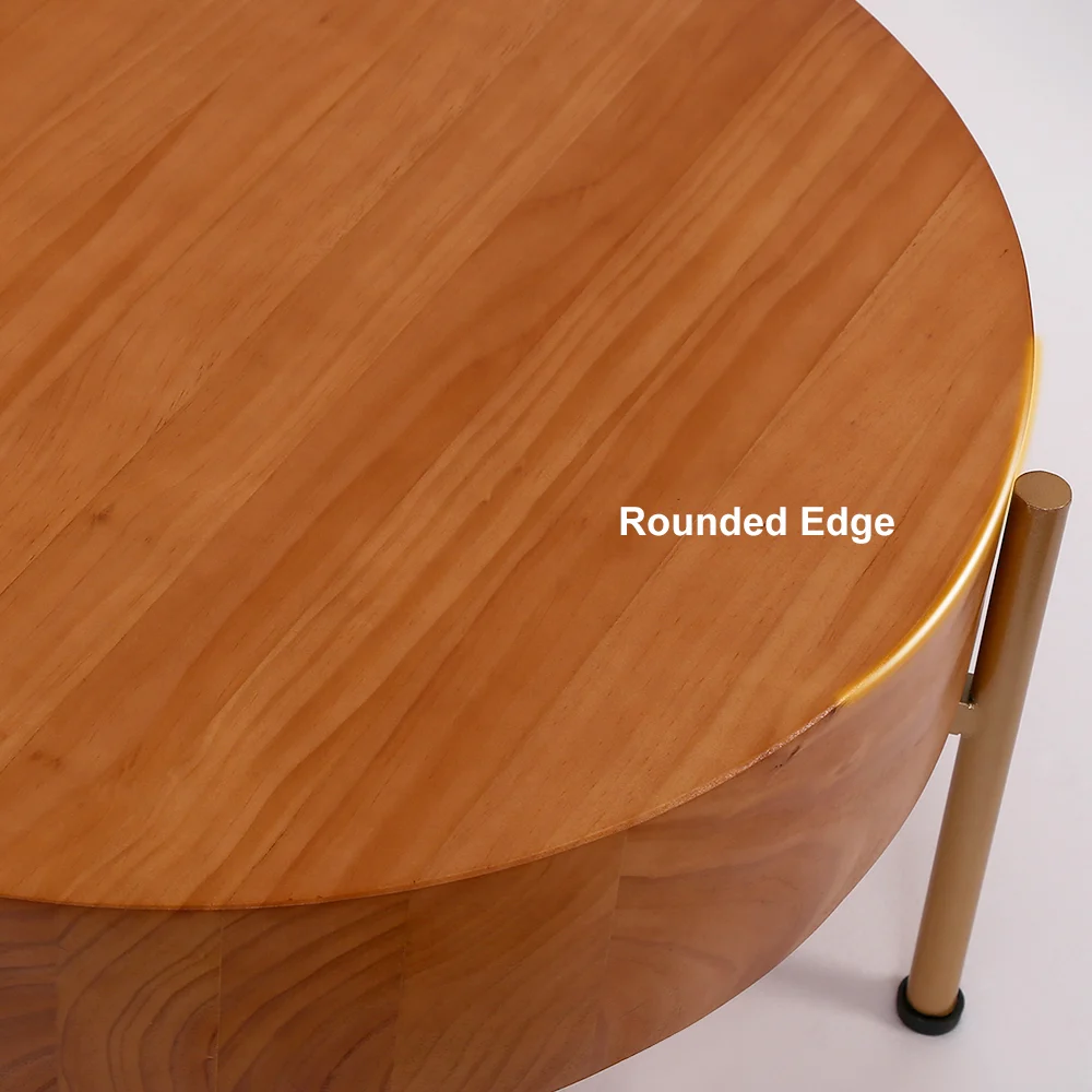 Rustic round coffee table with natural pine wood top and gold metal legs, minimalist design